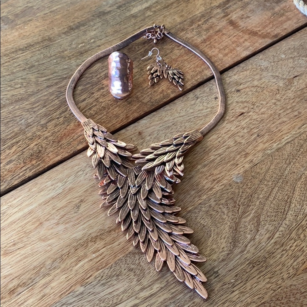 Set of copper color necklace, ring, and earrings